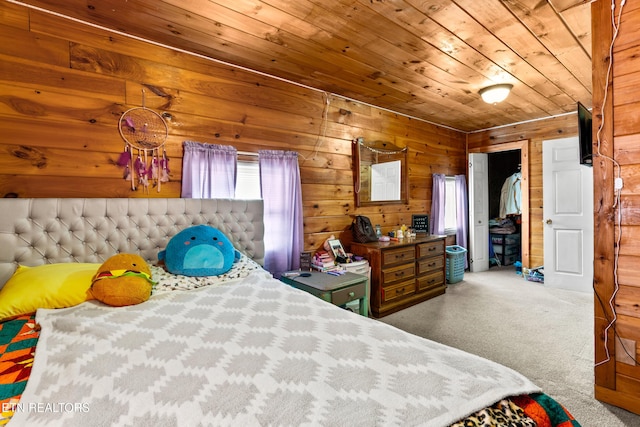 bedroom with wooden ceiling and wooden walls