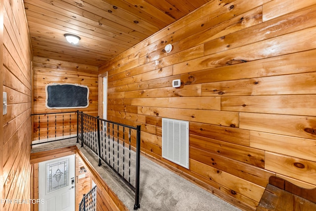 corridor with wooden ceiling and wooden walls