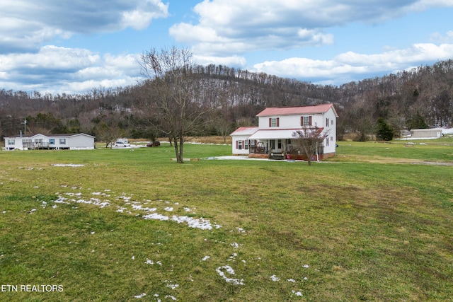 view of yard with covered porch