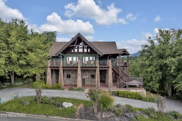 rear view of property with a deck