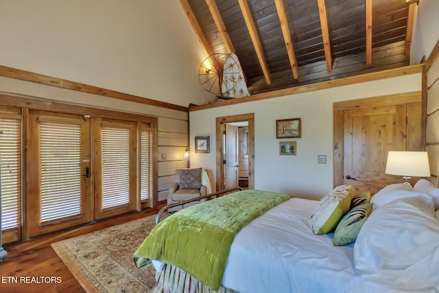 bedroom featuring hardwood / wood-style floors, beam ceiling, wooden ceiling, and high vaulted ceiling