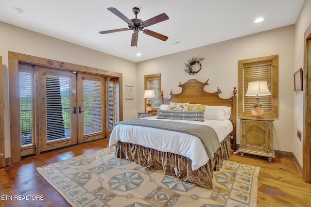 bedroom with access to exterior, ceiling fan, french doors, and light wood-type flooring