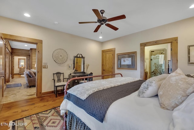 bedroom with ceiling fan and light wood-type flooring