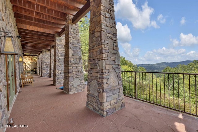 view of patio / terrace with a mountain view