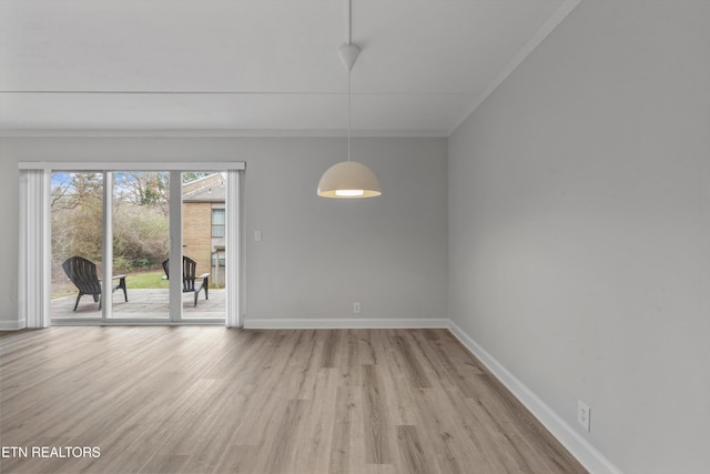 unfurnished room with ornamental molding and light hardwood / wood-style floors