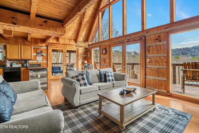 living room with french doors, light hardwood / wood-style flooring, beamed ceiling, wooden walls, and wood ceiling