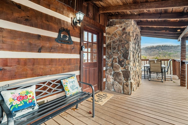 wooden terrace with a mountain view