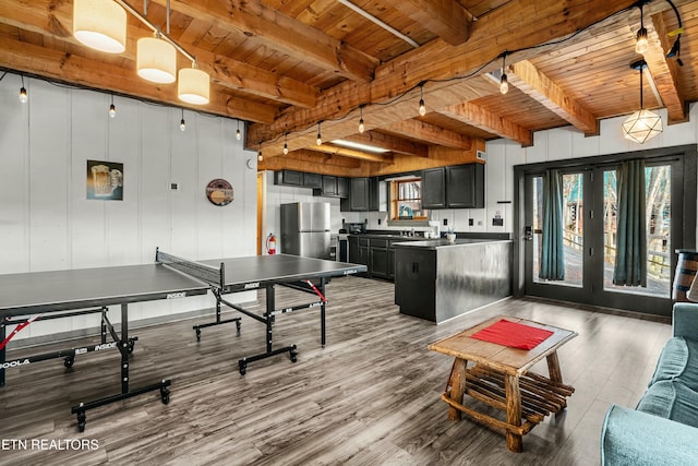 game room featuring beamed ceiling, hardwood / wood-style flooring, and wood ceiling