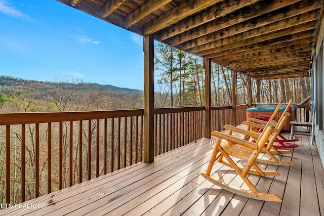 deck with a hot tub