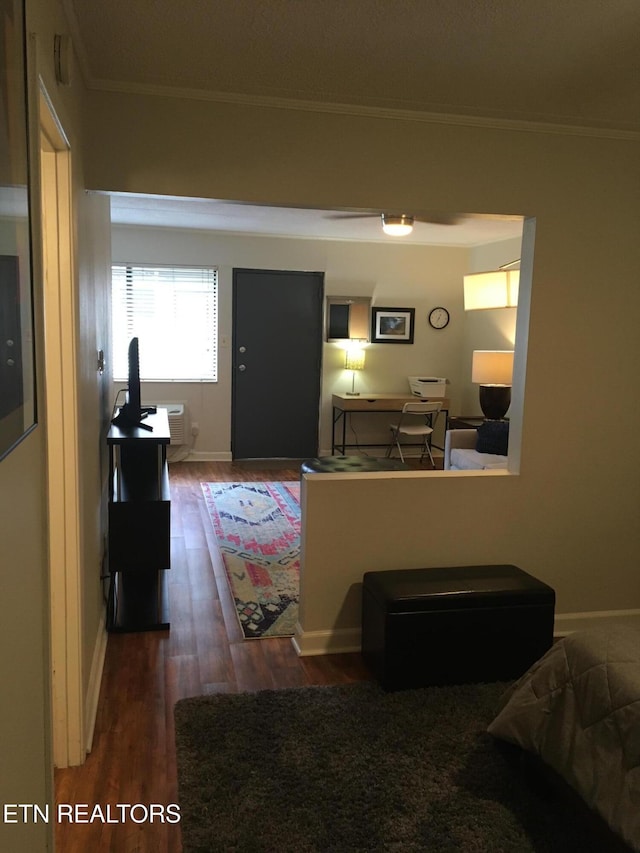 living room featuring dark hardwood / wood-style flooring and crown molding