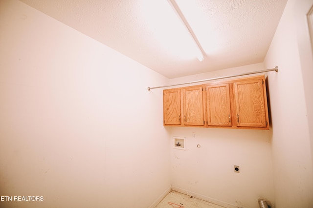 laundry room featuring washer hookup, cabinets, and hookup for an electric dryer