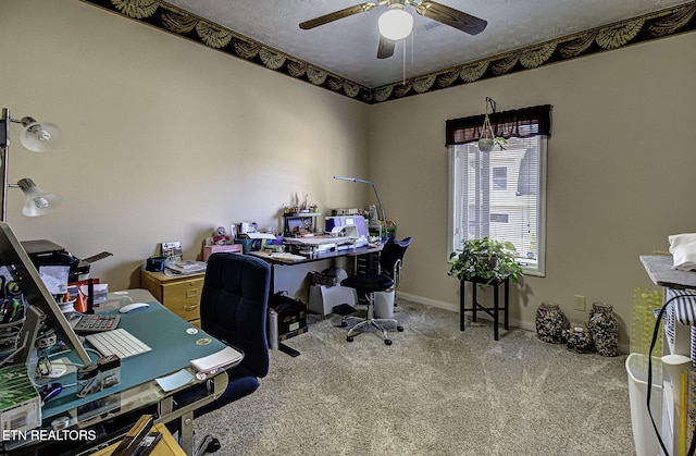 office area with carpet, a textured ceiling, baseboards, and a ceiling fan