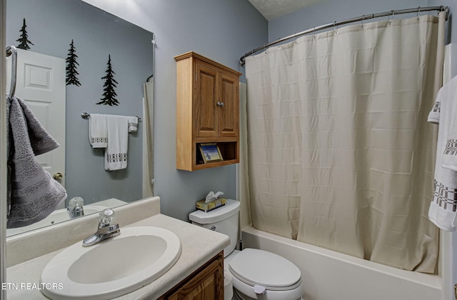 full bathroom with shower / bath combination with curtain, vanity, toilet, and a textured ceiling