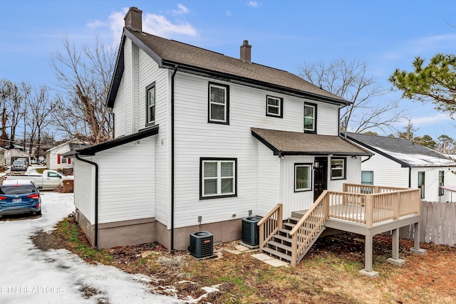 back of house featuring a wooden deck and cooling unit