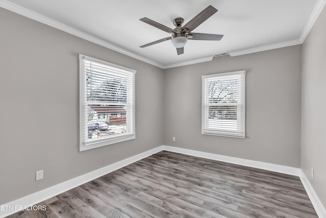 unfurnished room featuring hardwood / wood-style flooring, ceiling fan, and ornamental molding