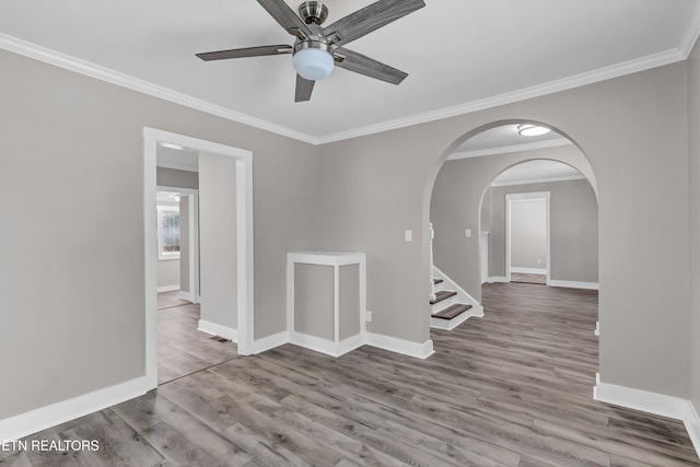 empty room with light hardwood / wood-style flooring, ceiling fan, and ornamental molding