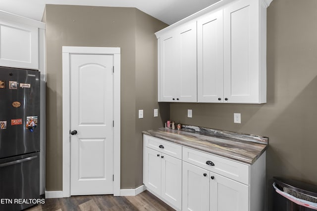 499 Woodland Trl, Sunbright, TN 37872 - kitchen with freestanding refrigerator, dark wood-style floors, white cabinetry, and dark countertops