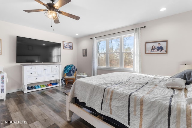 bedroom featuring ceiling fan and dark hardwood / wood-style flooring