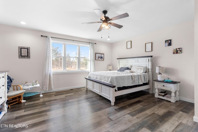 bedroom featuring ceiling fan and dark hardwood / wood-style flooring