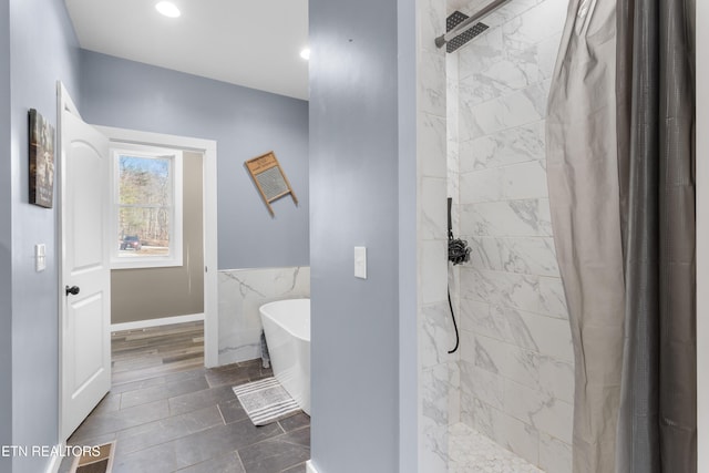 499 Woodland Trl, Sunbright, TN 37872 - bathroom with a tile shower, a freestanding bath, tile walls, a wainscoted wall, and recessed lighting