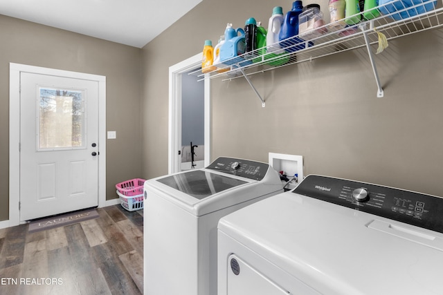 laundry area featuring wood-type flooring and washing machine and clothes dryer