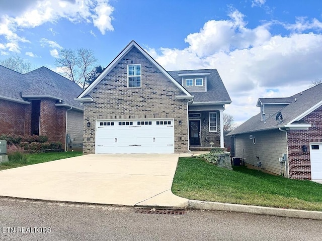 view of front of house with a front yard and a garage