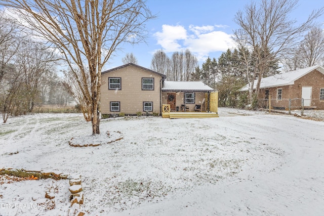 view of snow covered house