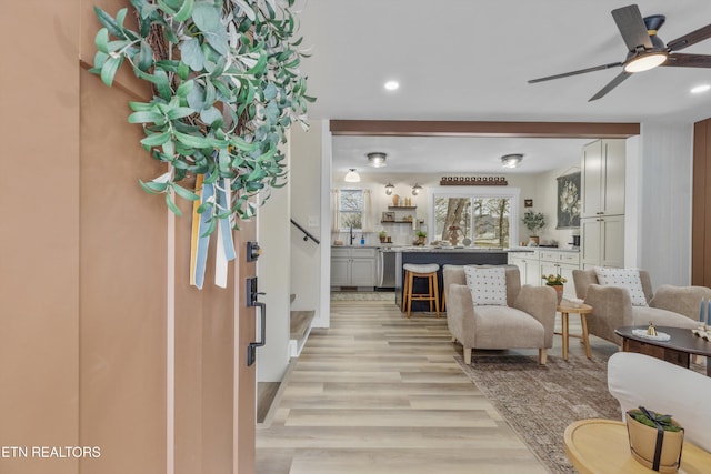 entryway with light wood-style flooring, ceiling fan, and recessed lighting