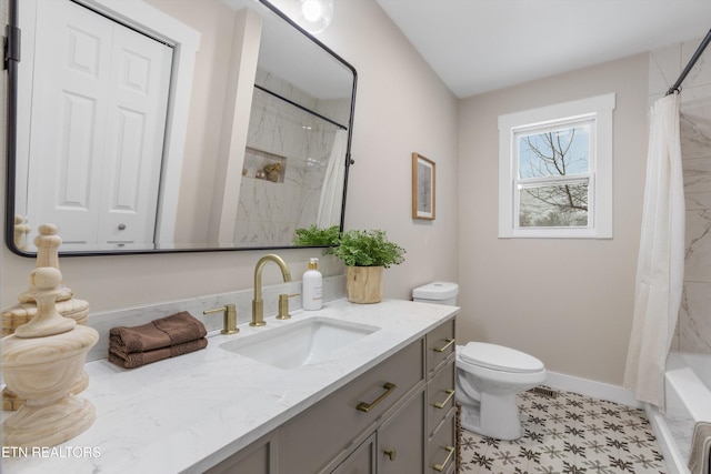 full bath featuring shower / bath combo, vanity, toilet, and baseboards