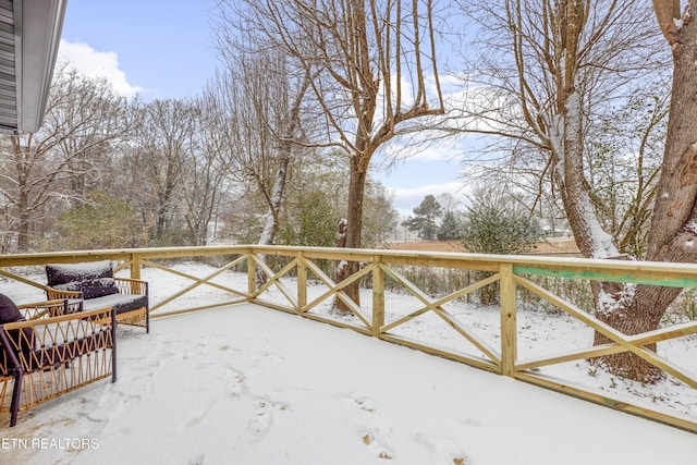 view of snow covered deck