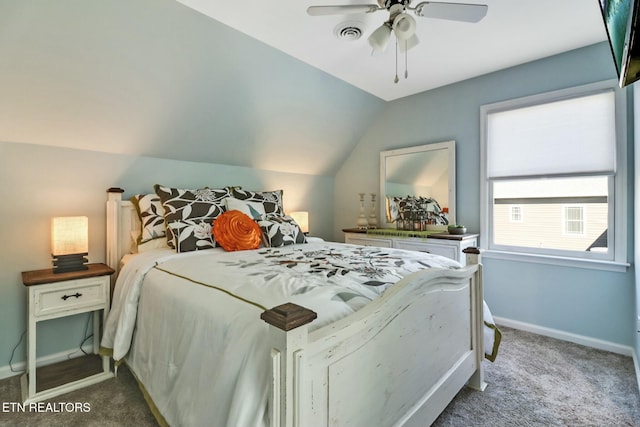 carpeted bedroom featuring ceiling fan and vaulted ceiling