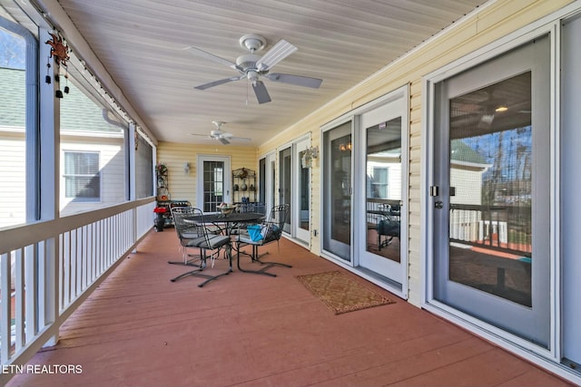 wooden terrace with ceiling fan