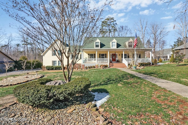 view of front facade featuring covered porch and a front lawn