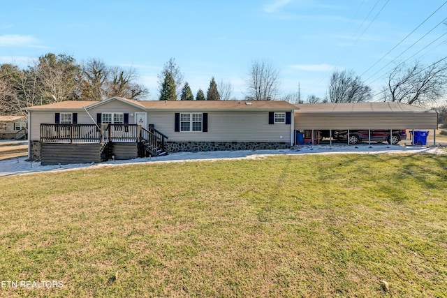 view of front of property with a carport, a wooden deck, and a front yard