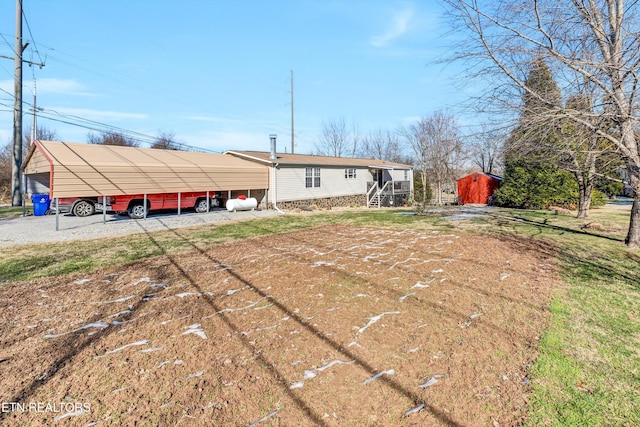 rear view of property with a carport