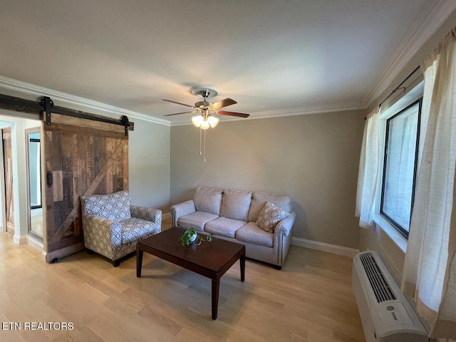 2733 Jersey Ave Unit C302, Knoxville, TN 37919 - living room with ornamental molding, a wall mounted AC, ceiling fan, a barn door, and light hardwood / wood-style floors