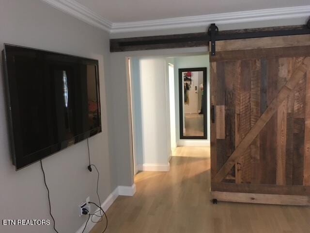 2733 Jersey Ave Unit C302, Knoxville, TN 37919 - corridor with a barn door, crown molding, and light hardwood / wood-style floors