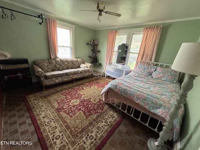 bedroom featuring ceiling fan and crown molding