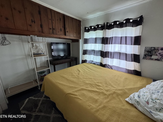 bedroom with crown molding