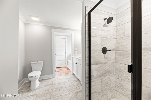 bathroom with walk in shower, vanity, ornamental molding, and toilet