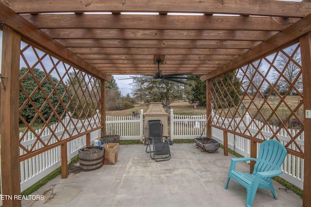 view of patio featuring ceiling fan and a pergola