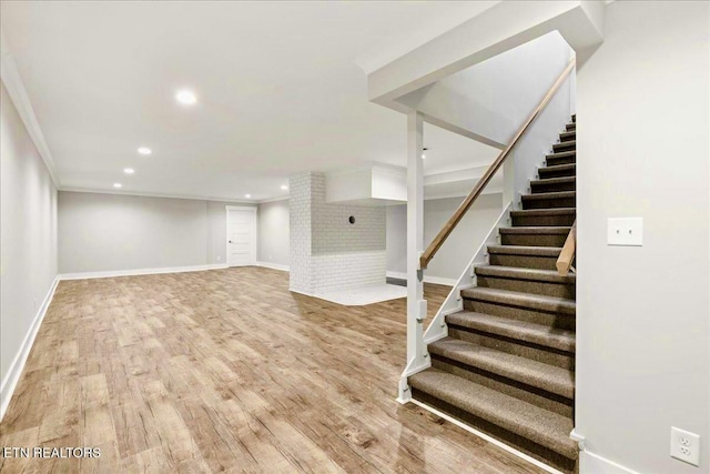 basement with hardwood / wood-style floors