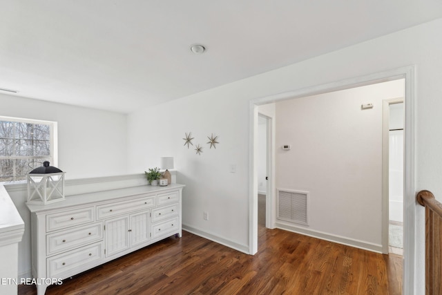 unfurnished bedroom featuring dark hardwood / wood-style floors