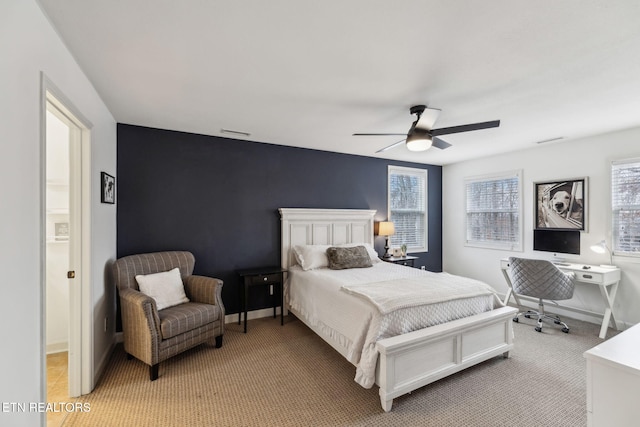 bedroom featuring light colored carpet and ceiling fan