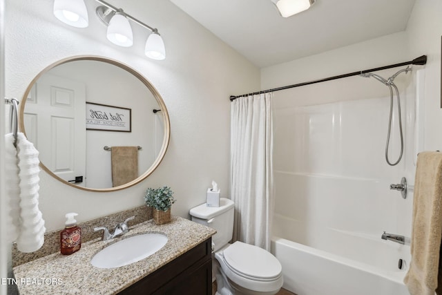 full bathroom with vanity, shower / bath combo, and toilet