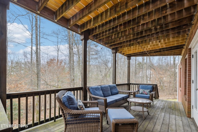 wooden deck featuring an outdoor living space