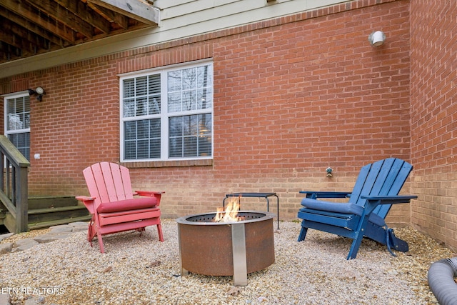 view of patio / terrace featuring an outdoor fire pit