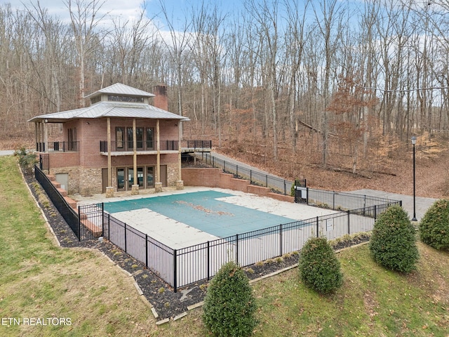 view of pool featuring a yard and a patio area