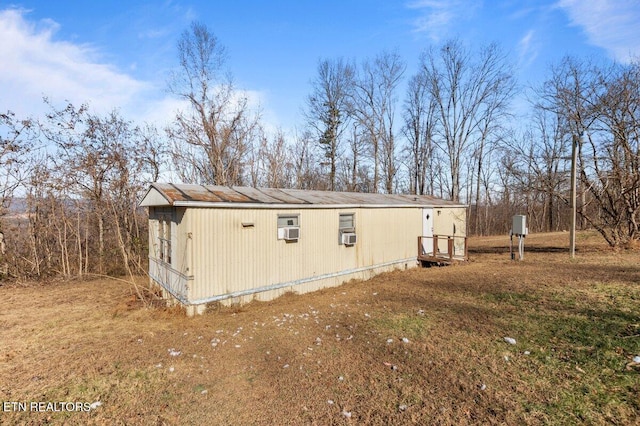 view of side of home with cooling unit