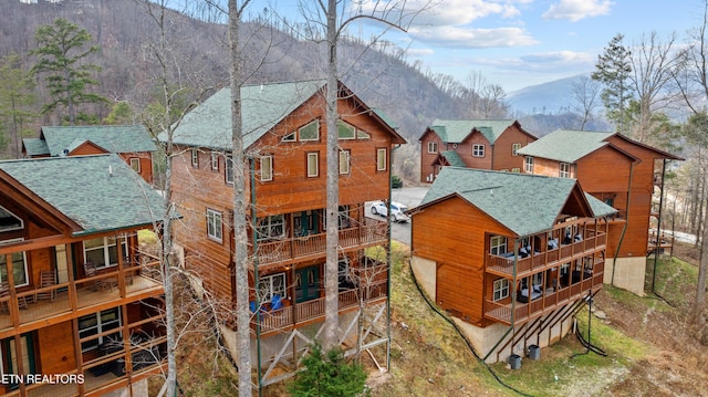 back of house featuring a mountain view